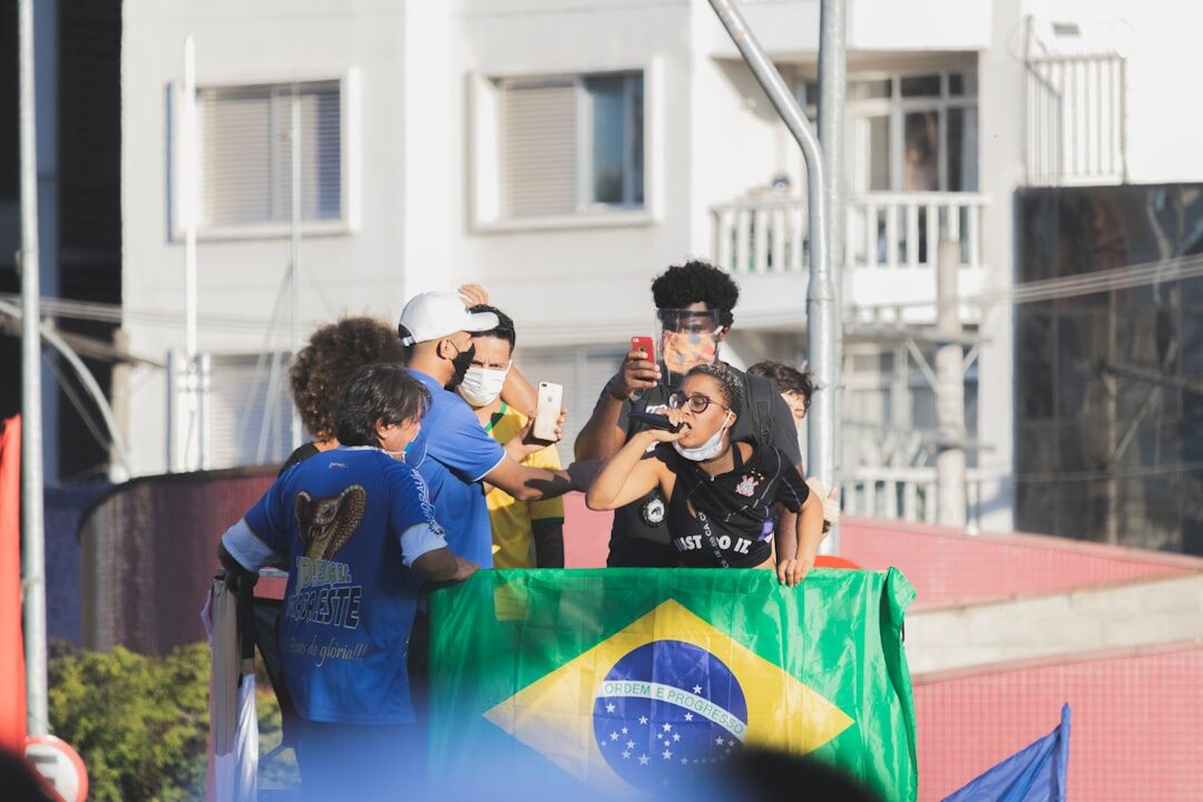 Diverse group of Brazilian adults talking and laughing during a communication workshop