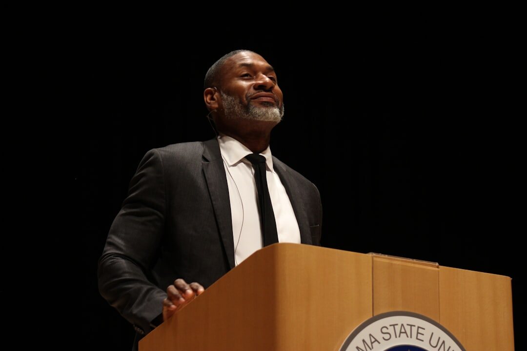 person giving speech on stage