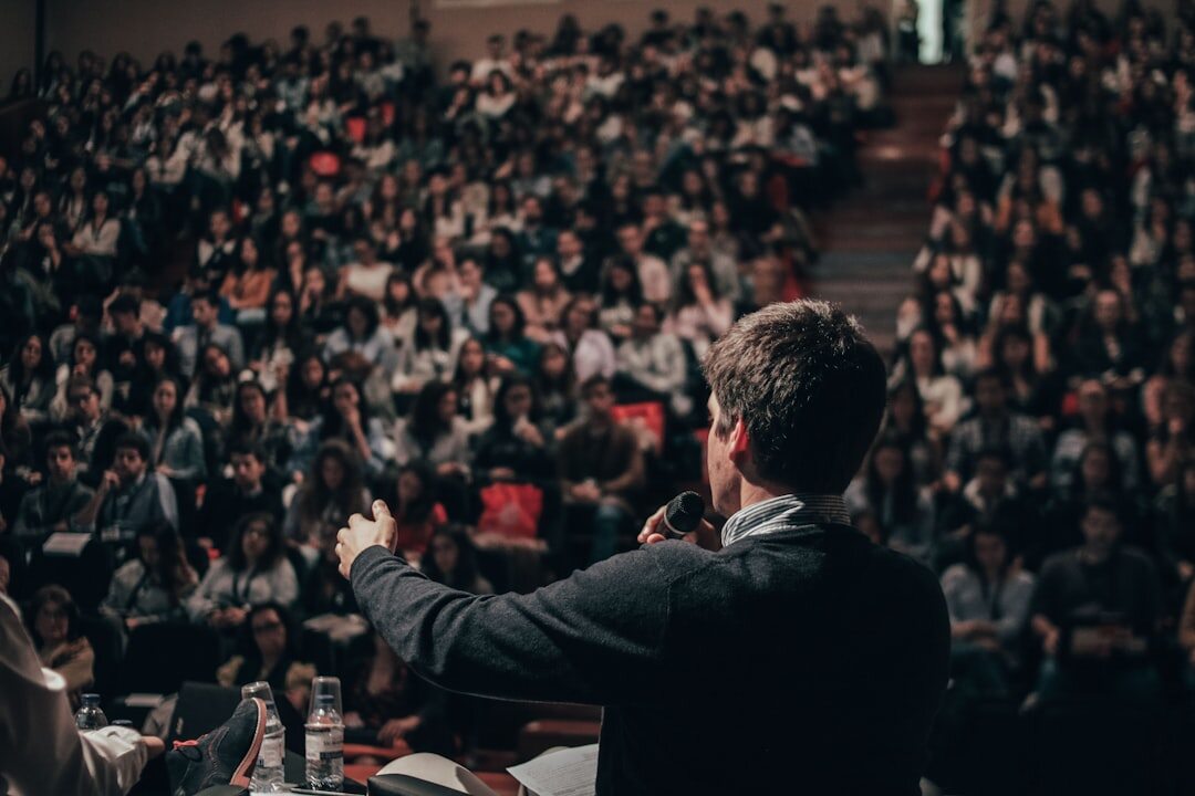 person giving speech on stage
