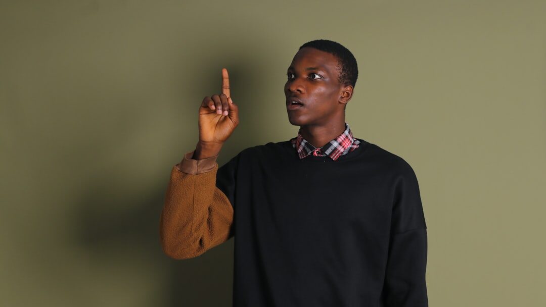 man gesturing while talking